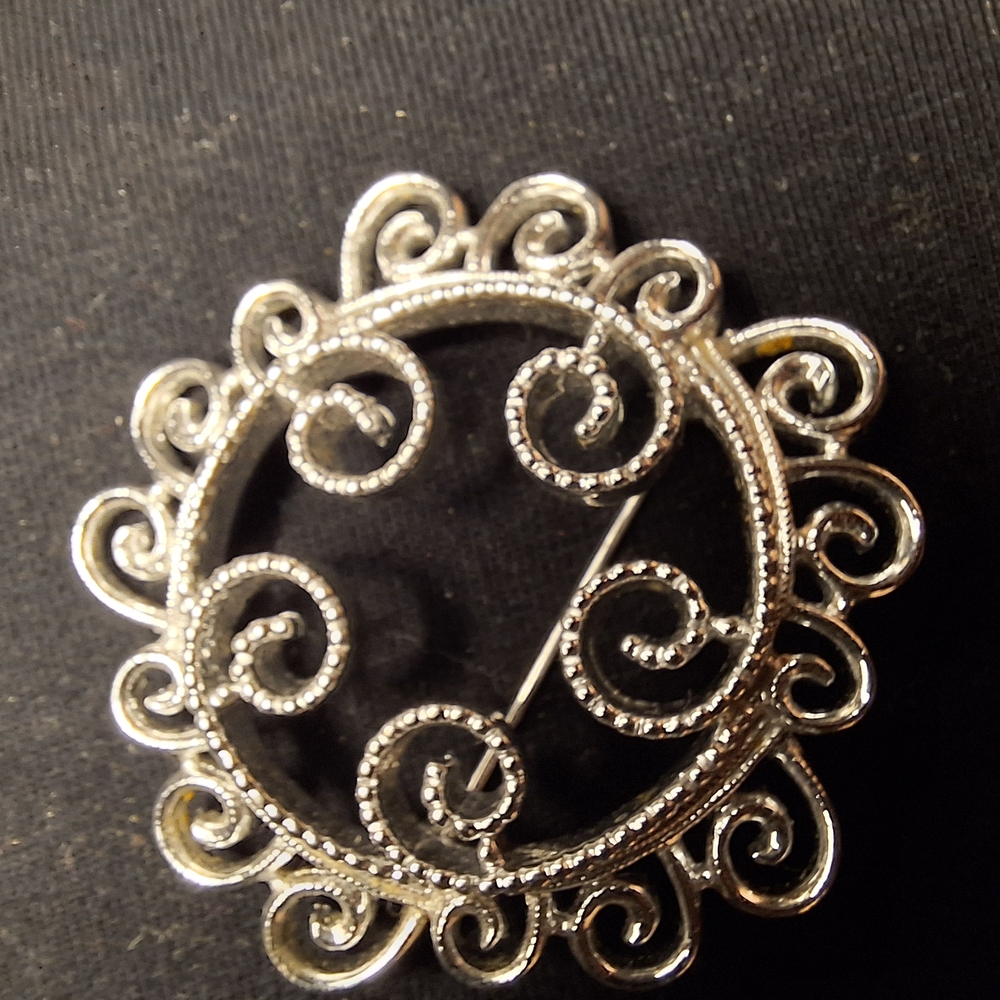 Elegant Silver Swirl Brooch